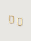 Gold hoop earrings on a light gray background