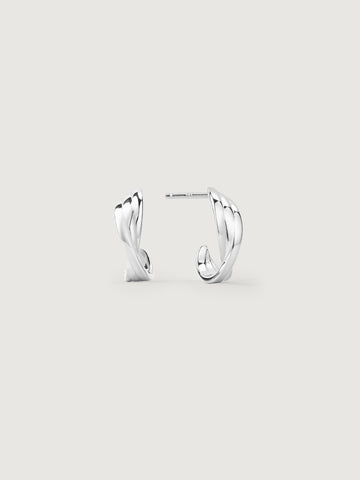 Pair of silver hoop earrings on a light gray background