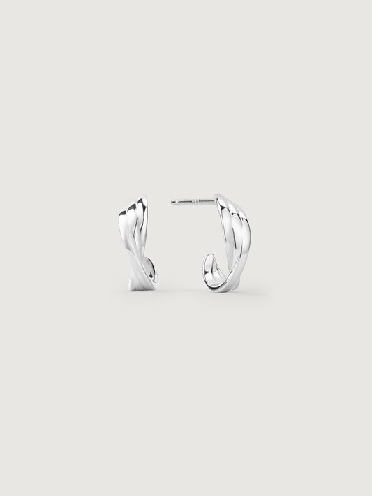 Pair of silver hoop earrings on a light gray background