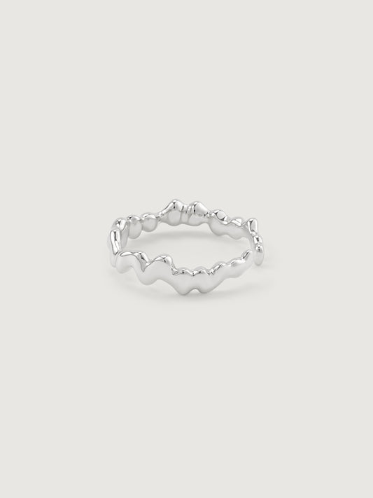 Silver ring with a textured weave design on a light gray background